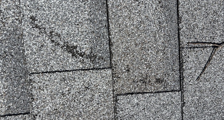 Close-up asphalt shingles with visible surface granules
